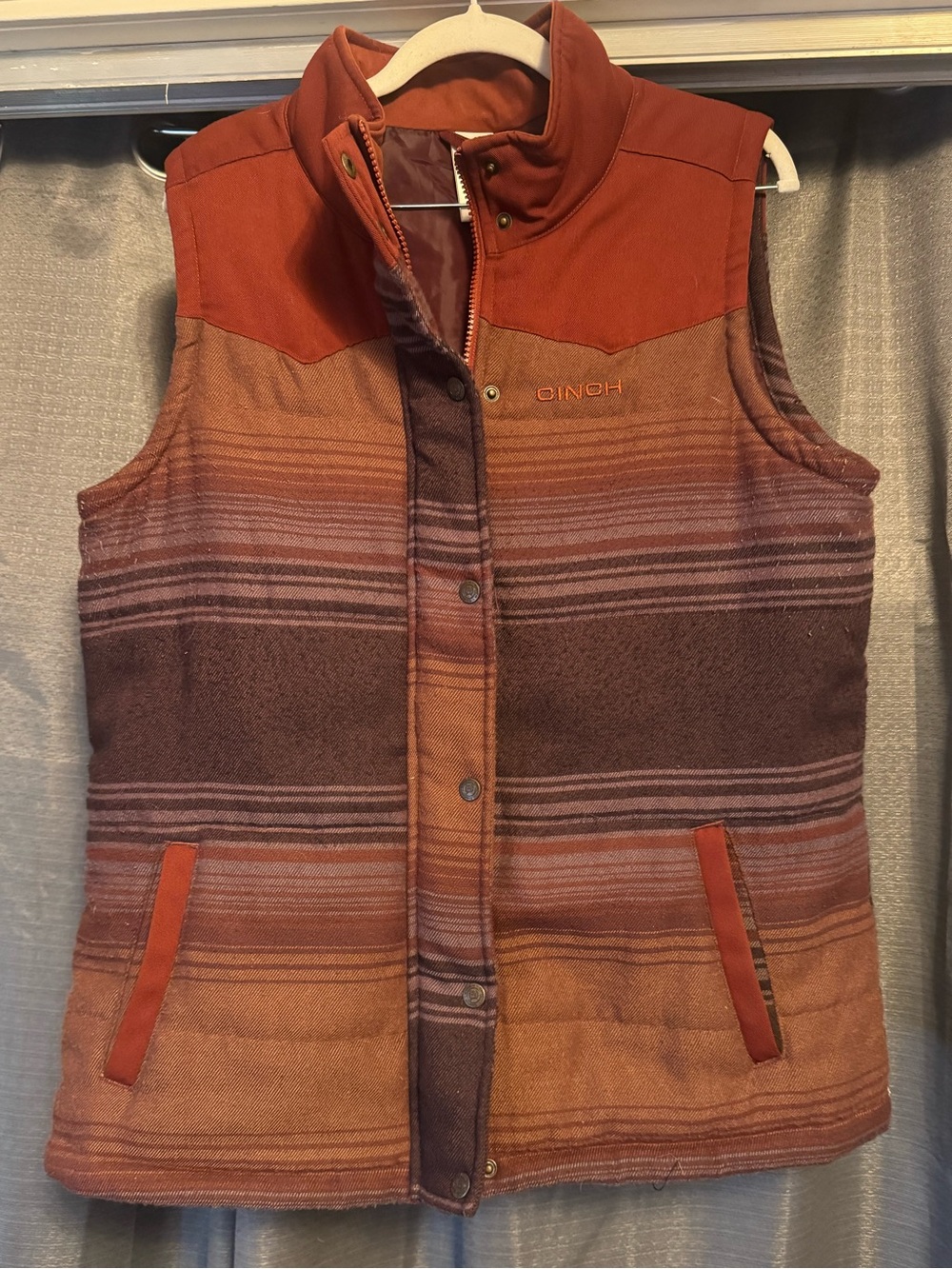 Cinch Women's Quilted Southwestern Stripe Vest in Rust and Brown